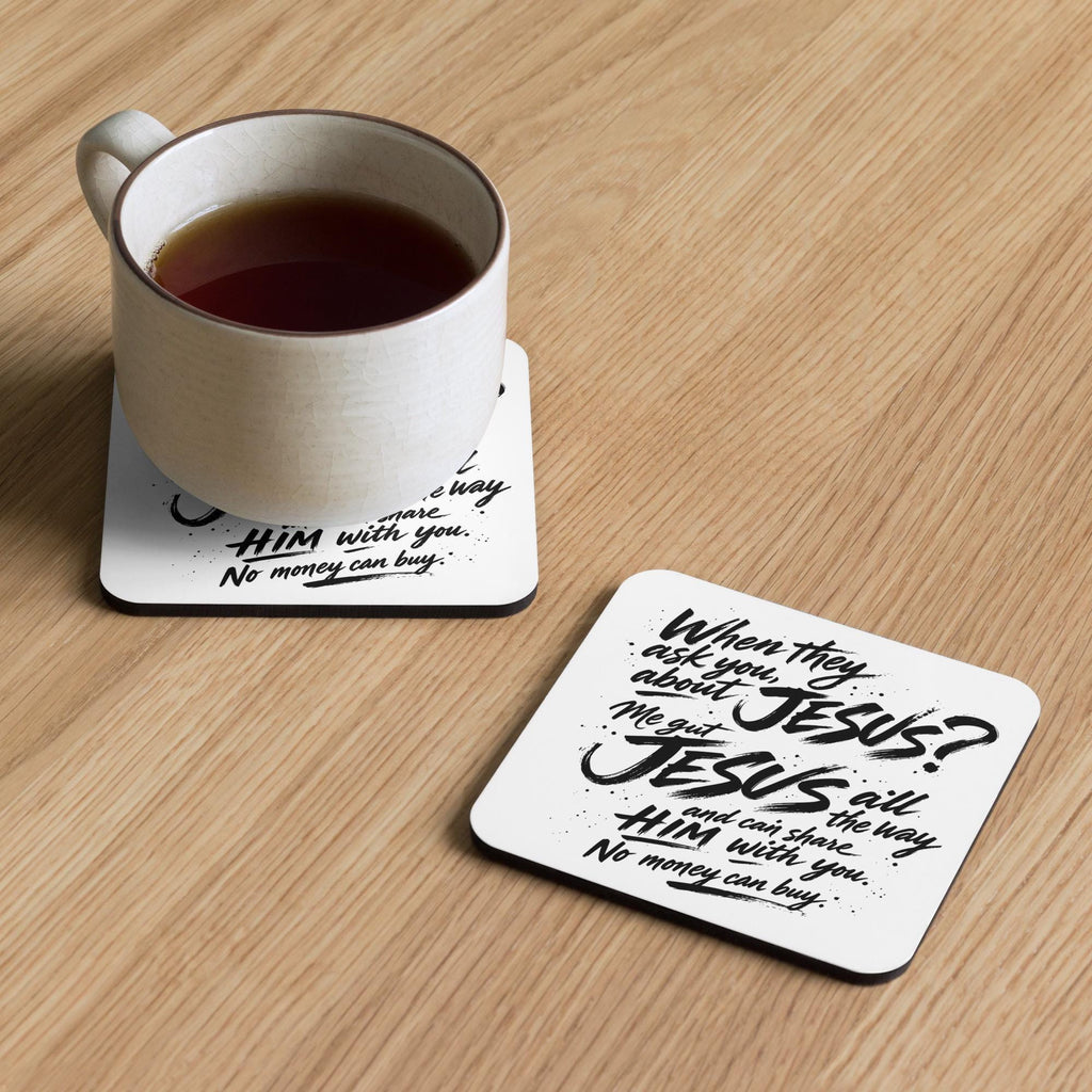 Jesus All the Way coasters on a wooden table with a cup of tea