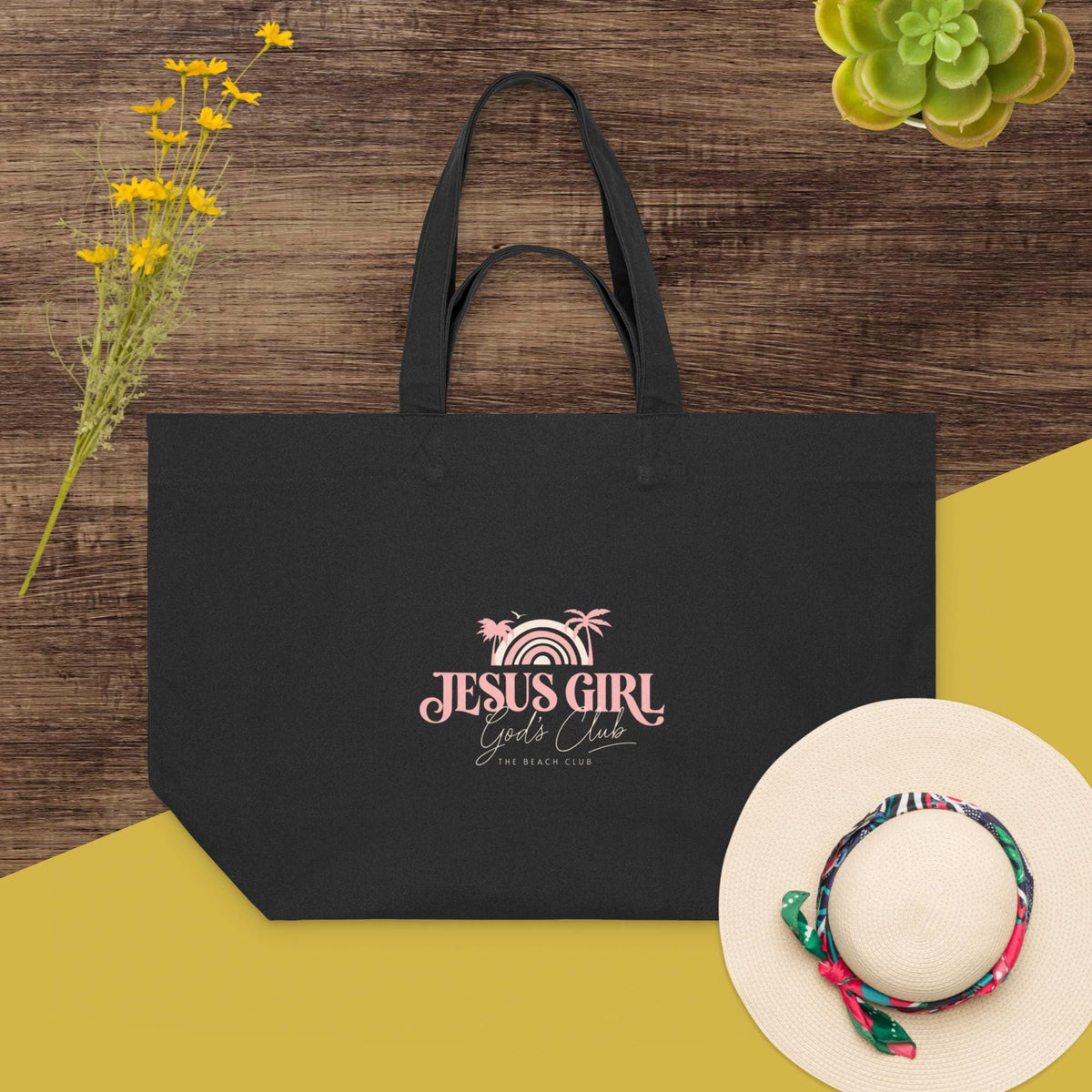 Black Jesus Girl large canvas tote styled with a sun hat
