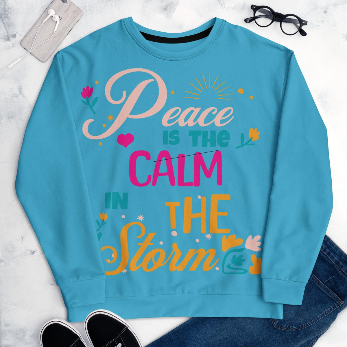 Peace Is the Calm in the Storm Christian sweatshirt styled flat lay
